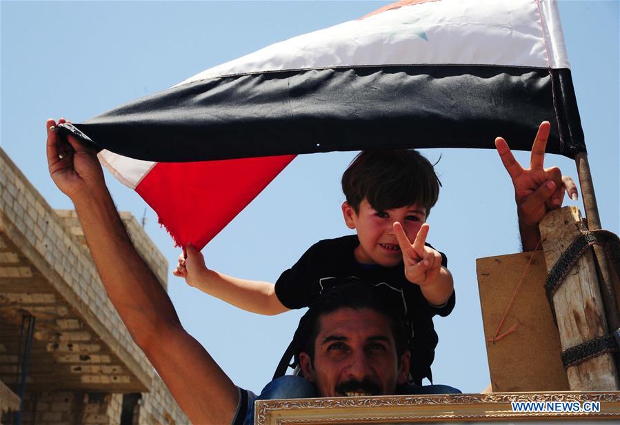 SYRIA-DARAA-PRO-GOVERNMENT-RALLY